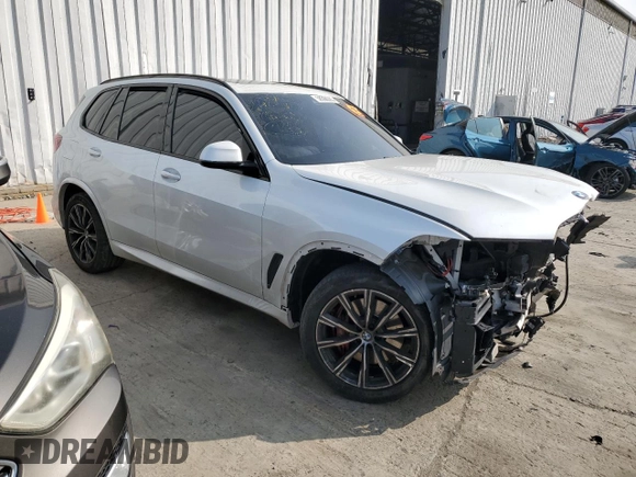 2021 BMW X5 xDrive40i with VIN 5UXCR6C00M9E75622, listed as a Copart auction lot 58568005 with Not provided miles and Salvage title. Bid and sale history available at DreamBid. Image 4.