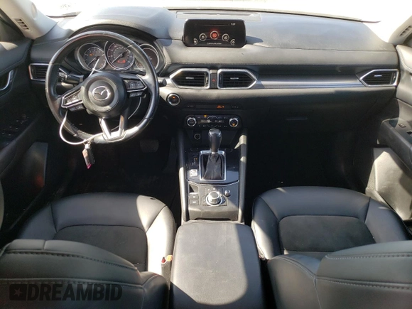 2018 Mazda CX-5 Touring z VIN JM3KFACM7J0370737, wystawiony jako Copart lot #60113725 z przebiegiem 131 385 mil mil oraz Szkoda całkowita • Salvage title. Historia ofert i sprzedaży dostępna na DreamBid. Obrazek 8.