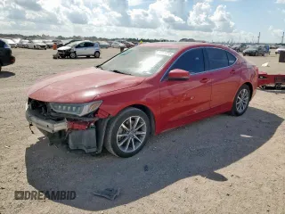 2018 Acura TLX with VIN 19UUB1F38JA011599, listed as a Copart auction lot 61077215 with 107,522 mi miles and Salvage title. Bid and sale history available at DreamBid. Image 1.