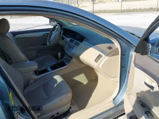 2005 Toyota Avalon XL z VIN 4T1BK36B55U032452, wystawiony jako IAAI lot #42054019 z przebiegiem 228 183 mil mil oraz . Historia ofert i sprzedaży dostępna na DreamBid. Obrazek 5.