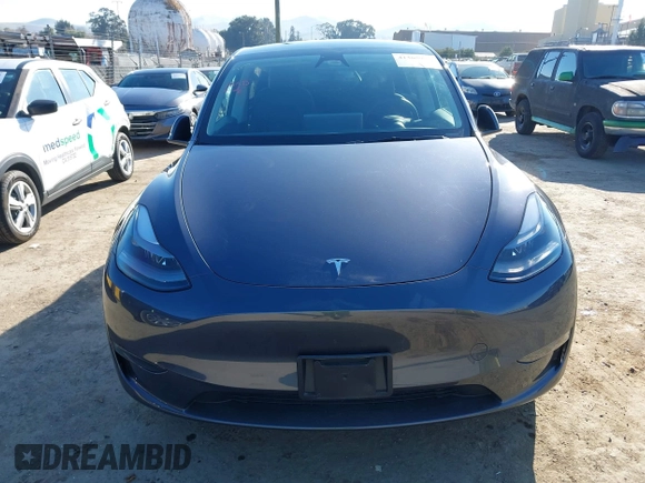 2023 Tesla Model Y Long Range with VIN 7SAYGAEE5PF964083, listed as a IAAI auction lot 41365919 with 26,008 mi miles and . Bid and sale history available at carsss.com. Image 13.
