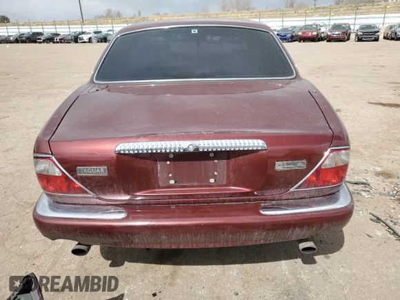 1998 Jaguar XJ Vanden Plas with VIN SAJKX6245WC830912, listed as a Copart auction lot 49717285 with 127,509 mi miles and Salvage Title. Bid and sale history available at DreamBid. Image 6.