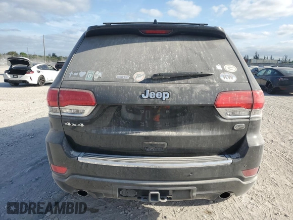 2015 Jeep Grand Cherokee Overland with VIN 1C4RJFCG6FC919637, listed as a Copart auction lot 52072925 with 111,552 mi miles and Salvage Title. Bid and sale history available at carsss.com. Image 6.