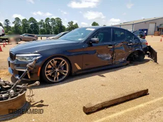 2018 BMW 5 Series M550i xDrive with VIN WBAJB9C54JB286450, listed as a Copart auction lot 61232125 with 88,479 mi miles and Salvage title. Bid and sale history available at DreamBid. Image 1.