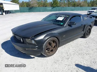 2005 Ford Mustang Deluxe with VIN 1ZVFT80N655136118, listed as a IAAI auction lot 41811969 with 104,071 mi miles. Bid and sale history available at carsss.com. Image 2.
