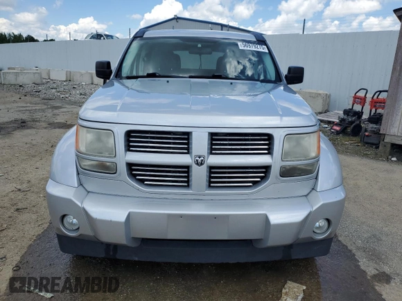 2011 Dodge Nitro Heat with VIN 1D4PU4GK0BW604975, listed as a Copart auction lot 56979275 with 160,494 mi miles and Salvage title. Bid and sale history available at DreamBid. Image 5.