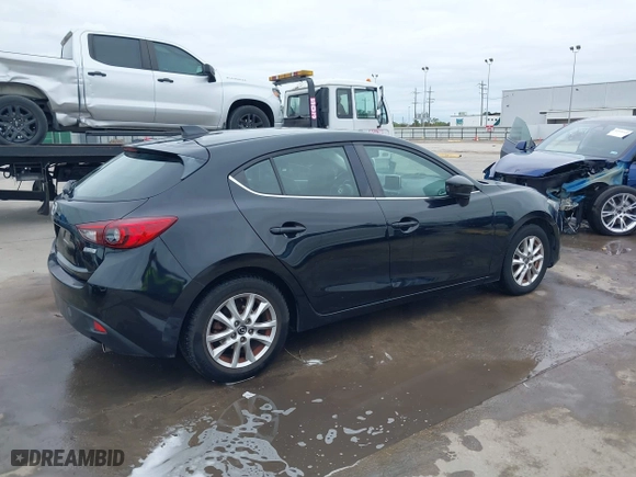 2016 Mazda Mazda3 i Grand Touring with VIN 3MZBM1N75GM267972, listed as a IAAI auction lot 41030060 with 86,065 mi miles. Bid and sale history available at carsss.com. Image 4.