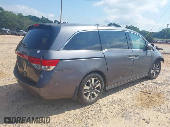 2015 Honda Odyssey Touring Elite with VIN 5FNRL5H95FB127156, listed as a IAAI auction lot 42618059 with 160,074 mi miles and . Bid and sale history available at DreamBid. Image 4.