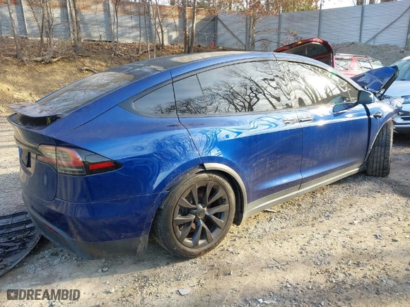 2023 Tesla Model X with VIN 7SAXCDE52PF399834, listed as a IAAI auction lot 41783696 with NaN miles. Bid and sale history available at carsss.com. Image 4.