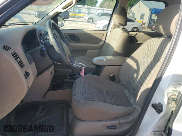 2004 Ford Escape XLT with VIN 1FMYU93104KA32047, listed as a Copart auction lot 61364985 with 160,822 mi miles and Salvage title. Bid and sale history available at DreamBid. Image 7.
