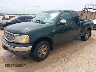 2001 Ford F-150 XL with VIN 1FTZX07271KB88709, listed as a IAAI auction lot 42599181 with 153,985 mi miles and . Bid and sale history available at DreamBid. Image 2.