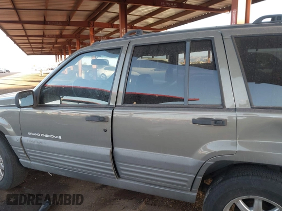 1998 Jeep Grand Cherokee Laredo with VIN 1J4GZ58S9WC136684, listed as a IAAI auction lot 41444103 with 1 mi miles. Bid and sale history available at carsss.com. Image 13.