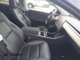 2021 Tesla Model Y Long Range z VIN 5YJYGDEE6MF070068, wystawiony jako IAAI lot #42224634 z przebiegiem 33 850 mil mil oraz . Historia ofert i sprzedaży dostępna na DreamBid. Obrazek 5.