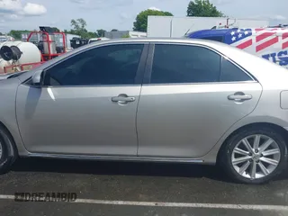 2014 Toyota Camry SE z VIN 4T1BK1FK6EU551126, wystawiony jako IAAI lot #42192663 z przebiegiem 178 875 mil mil oraz . Historia ofert i sprzedaży dostępna na DreamBid. Obrazek 14.
