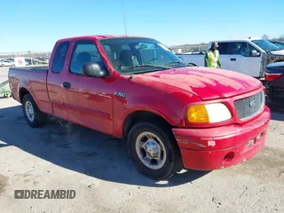 2004 Ford F-150 Heritage XL with VIN 2FTRX17214CA54597, listed as a IAAI auction lot 41206943 with 216,063 mi miles. Bid and sale history available at carsss.com. Image 1.