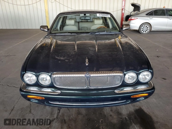 1999 Jaguar XJ with VIN SAJKX6046XC855872, listed as a Copart auction lot 47060465 with 65,286 mi miles and Clean title. Bid and sale history available at DreamBid. Image 5.