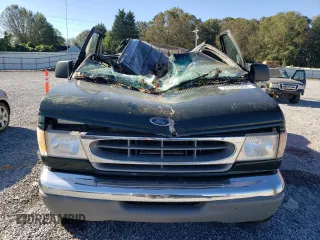 1999 Ford Econoline Passenger XL with VIN 1FBSS31L0XHB12679, listed as a Copart auction lot 74257504 with 136,821 mi miles and Salvage Title. Bid and sale history available at DreamBid. Image 5.