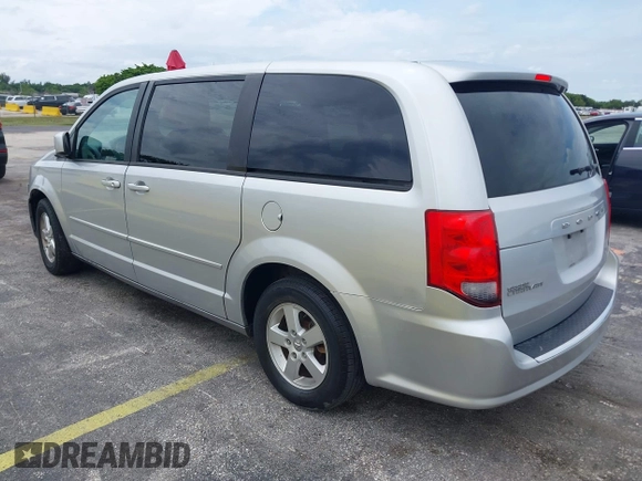 2012 Dodge Grand Caravan SXT with VIN 2C4RDGCG3CR308173, listed as a IAAI auction lot 42255879 with 96,489 mi miles and . Bid and sale history available at DreamBid. Image 3.