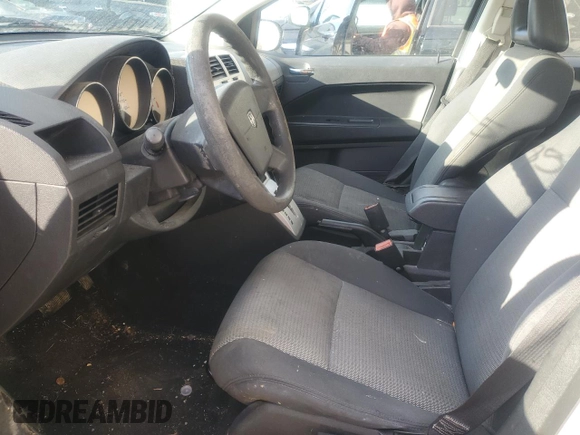 2009 Dodge Caliber SXT z VIN 1B3HB48A59D104136, wystawiony jako Copart lot #45971285 z przebiegiem 291 374 mil mil oraz Szkoda całkowita • Salvage title. Historia ofert i sprzedaży dostępna na DreamBid. Obrazek 7.