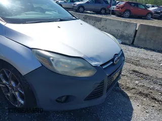 2014 Ford Focus Titanium with VIN 1FADP3J27EL227261, listed as a IAAI auction lot 41972536 with 172,470 mi miles. Bid and sale history available at carsss.com. Image 6.