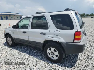2003 Ford Escape XLT Popular with VIN 1FMYU03103KA06199, listed as a Copart auction lot 58731515 with 181,429 mi miles and Salvage title. Bid and sale history available at DreamBid. Image 2.