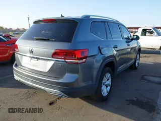 2018 Volkswagen Atlas SE with VIN 1V2DR2CA8JC502499, listed as a IAAI auction lot 41562852 with 142,362 mi miles and . Bid and sale history available at DreamBid. Image 4.