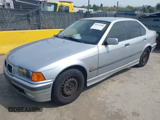 1997 BMW 3 Series 318iA with VIN WBACC0322VEK25478, listed as a IAAI auction lot 42033040 with 212,320 mi miles. Bid and sale history available at carsss.com. Image 17.
