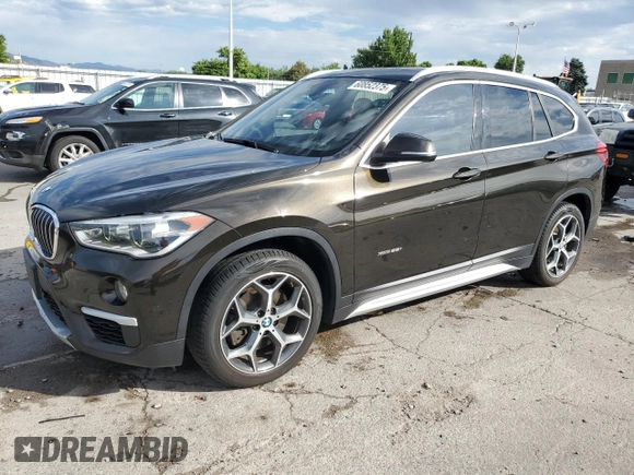 2017 BMW X1 xDrive28i with VIN WBXHT3C32H5F71690, listed as a Copart auction lot 60852375 with 67,475 mi miles and Salvage title. Bid and sale history available at DreamBid. Image 1.