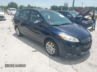 2015 Mazda 5 Sport z VIN JM1CW2BL7F0186336, wystawiony jako IAAI lot #42509199 z przebiegiem 161 586 mil mil oraz . Historia ofert i sprzedaży dostępna na DreamBid. Obrazek 1.