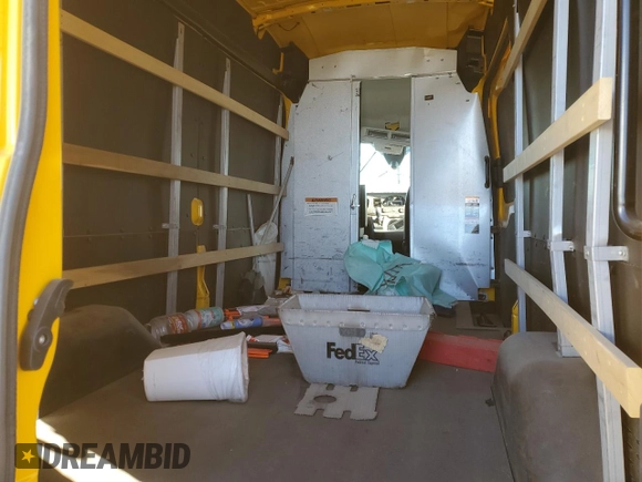 2023 Ford Transit Cargo with VIN 1FTBR1X89PKA25414, listed as a Copart auction lot 46476085 with 61,328 mi miles and Salvage title. Bid and sale history available at DreamBid. Image 11.
