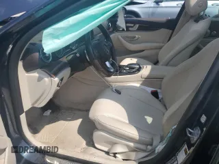 2017 Mercedes-Benz E 300 Luxury with VIN WDDZF4KBXHA185598, listed as a Copart auction lot 61011935 with 59,116 mi miles and Salvage title. Bid and sale history available at DreamBid. Image 7.