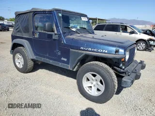 2005 Jeep Wrangler Rubicon with VIN 1J4FA69S05P351725, listed as a Copart auction lot 71411904 with 144,557 mi miles and Salvage Title. Bid and sale history available at carsss.com. Image 4.