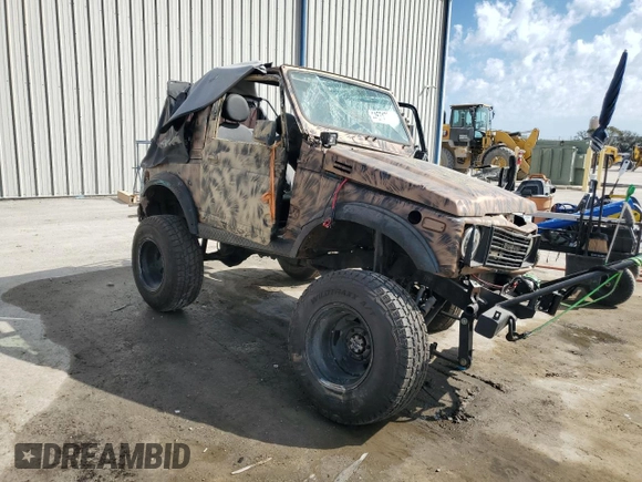 1988 Suzuki Samurai z VIN JS4JC51C6J4271251, wystawiony jako Copart lot #44574795 z przebiegiem 14 542 mil mil oraz Szkody całkowita. Historia ofert i sprzedaży dostępna na DreamBid. Obrazek 4.