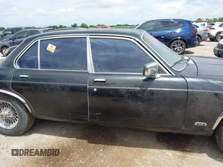 1982 Jaguar XJ with VIN SAJAV1248CC341050, listed as a IAAI auction lot 42653594 with Not provided miles and . Bid and sale history available at DreamBid. Image 13.