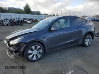 2023 Tesla Model Y Long Range z VIN 7SAYGDEE1PF585227, wystawiony jako Copart lot #50779305 z przebiegiem 67 205 mil mil oraz Szkoda całkowita • Salvage title. Historia ofert i sprzedaży dostępna na DreamBid. Obrazek 1.