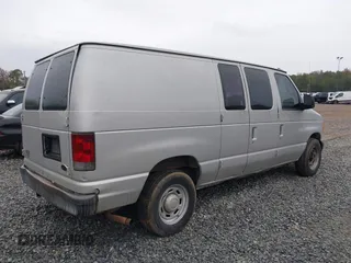 2005 Ford Econoline Cargo with VIN 1FTRE14W85HA67080, listed as a IAAI auction lot 40910996 with 599,247 mi miles. Bid and sale history available at carsss.com. Image 4.
