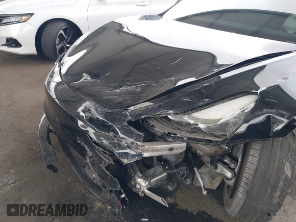 2023 Tesla Model 3 with VIN 5YJ3E1EA7PF473749, listed as a IAAI auction lot 41921478 with 21,483 mi miles and . Bid and sale history available at DreamBid. Image 6.