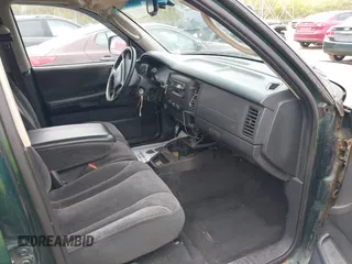 2001 Dodge Dakota Sport z VIN 1B7HG2ANX1S256902, wystawiony jako IAAI lot #42037703 z przebiegiem 121 914 mil mil oraz . Historia ofert i sprzedaży dostępna na DreamBid. Obrazek 5.