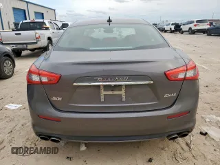 2018 Maserati Ghibli S Q4 GranLusso z VIN ZAM57YTL8J1265648, wystawiony jako Copart lot #56295795 z przebiegiem 51 857 mil mil oraz Szkoda całkowita • Salvage title. Historia ofert i sprzedaży dostępna na DreamBid. Obrazek 6.