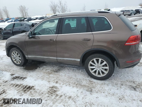 2012 Volkswagen Touareg Sport z VIN WVGEF9BP8CD006057, wystawiony jako Copart lot #47739265 z przebiegiem 213 580 mil mil oraz Szkoda całkowita • Salvage title. Historia ofert i sprzedaży dostępna na DreamBid. Obrazek 2.