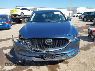 2020 Mazda CX-5 Touring z VIN JM3KFBCM2L0848233, wystawiony jako IAAI lot #42189719 z przebiegiem 80 893 mil mil oraz . Historia ofert i sprzedaży dostępna na DreamBid. Obrazek 13.