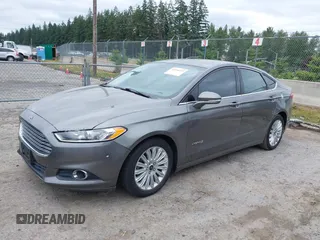 2014 Ford Fusion SE Hybrid with VIN 3FA6P0LU6ER285188, listed as a IAAI auction lot 42516215 with 122,899 mi miles and . Bid and sale history available at DreamBid. Image 2.