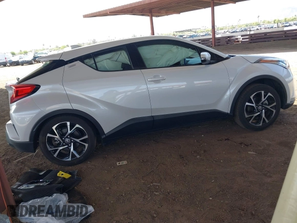 2022 Toyota C-HR XLE with VIN NMTKHMBX5NR147226, listed as a IAAI auction lot 42068867 with 21,863 mi miles. Bid and sale history available at carsss.com. Image 4.