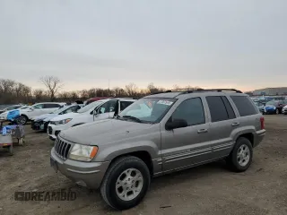 1999 Jeep Grand Cherokee Limited with VIN 1J4GW68SXXC582343, listed as a Copart auction lot 51067695 with 157,456 mi miles and Clean Title. Bid and sale history available at carsss.com. Image 1.