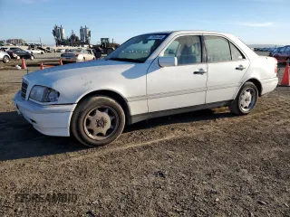 1994 Mercedes-Benz C with VIN WDBHA28E6RF098536, listed as a Copart auction lot 77804734 with 181,285 mi miles and Clean Title. Bid and sale history available at carsss.com. Image 1.