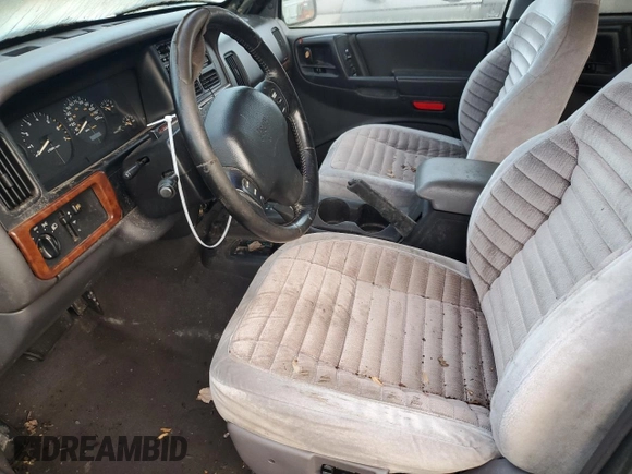 1997 Jeep Grand Cherokee Laredo with VIN 1J4GZ58S1VC741586, listed as a Copart auction lot 77619394 with 0 mi miles and Clean Title. Bid and sale history available at carsss.com. Image 7.