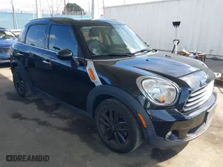 2012 MINI Cooper Countryman with VIN WMWZB3C52CWM06855, listed as a IAAI auction lot 41880609 with NaN miles. Bid and sale history available at carsss.com. Image 1.