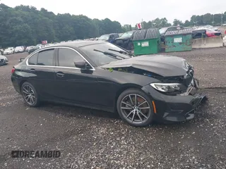 2020 BMW 3 Series 330i xDrive with VIN WBA5R7C05LFH48132, listed as a IAAI auction lot 39887553 with 75,143 mi miles. Bid and sale history available at carsss.com. Image 1.