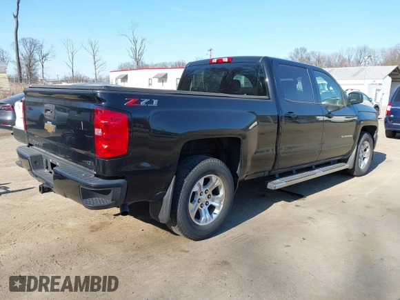 2018 Chevrolet Silverado 1500 LT with VIN 1GCUKREC3JF119906, listed as a IAAI auction lot 41765398 with 122,472 mi miles and . Bid and sale history available at DreamBid. Image 4.