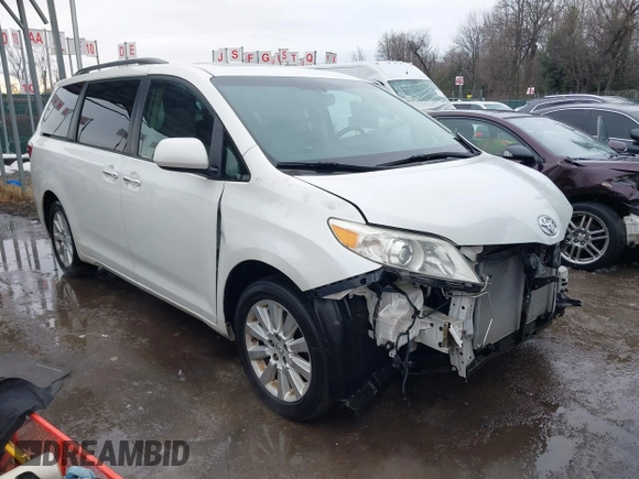 2015 Toyota Sienna Ltd with VIN 5TDDK3DC9FS115784, listed as a IAAI auction lot 41355934 with 125,675 mi miles. Bid and sale history available at carsss.com. Image 1.